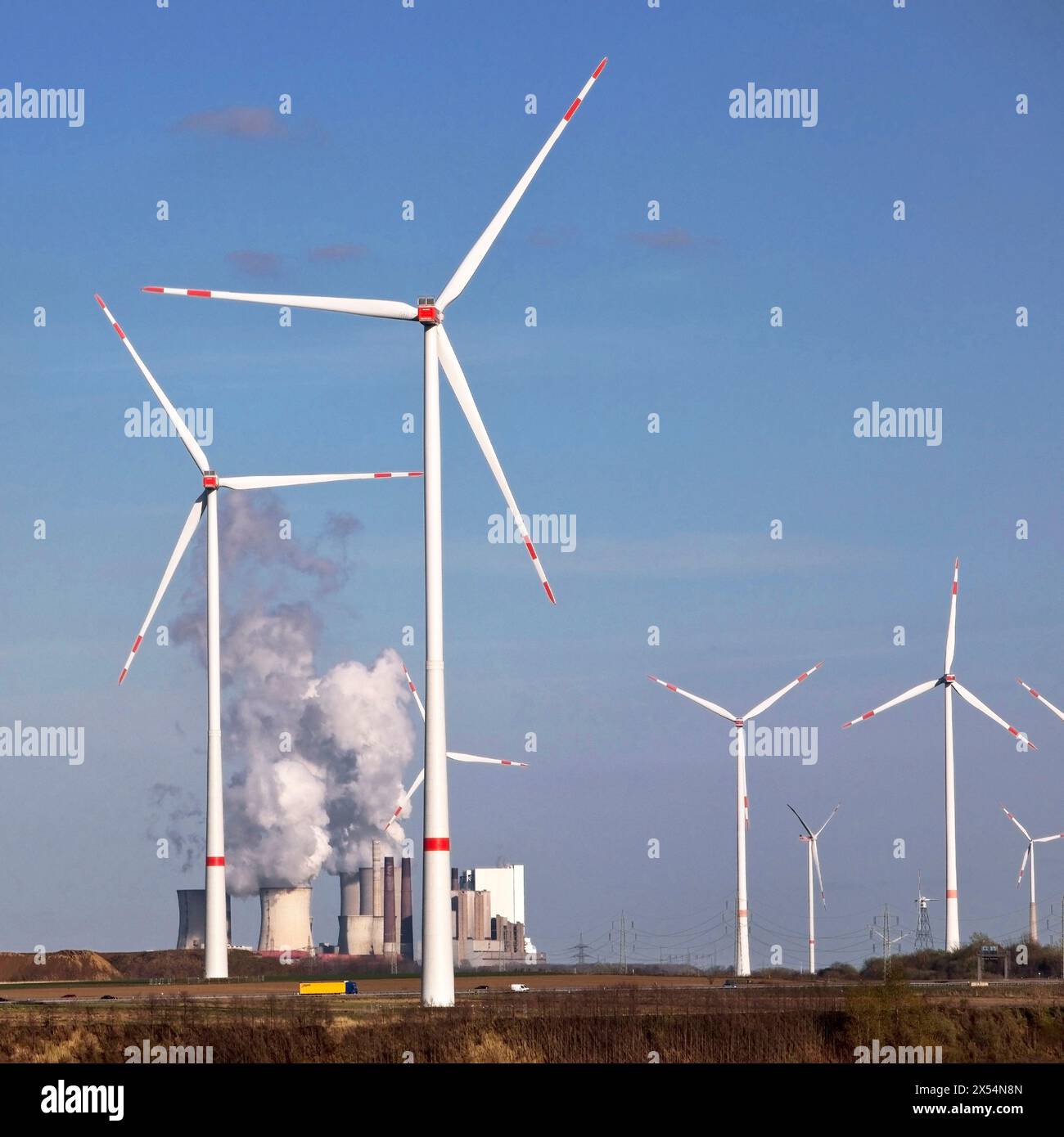 wind turbines with the Neurath power plant, Germany, North Rhine-Westphalia, Rhineland, Juechen Stock Photo