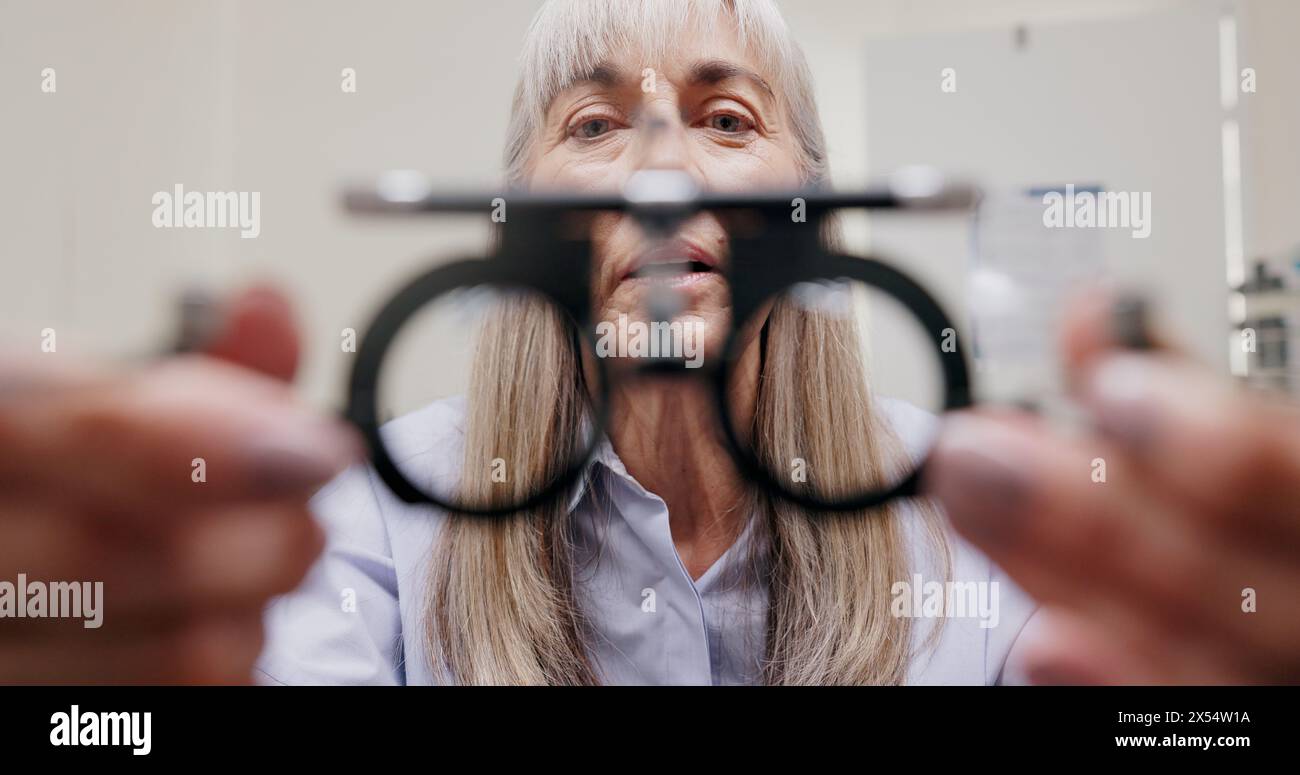 Mature woman, optometrist and frame for eye care or equipment for ...