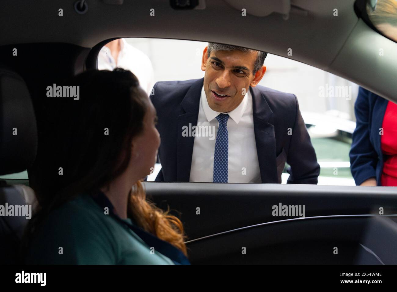 Prime Minister Rishi Sunak talks with employees during a visit to the offices of Wayve Technologies in London. Picture date: Tuesday May 7, 2024. Stock Photo