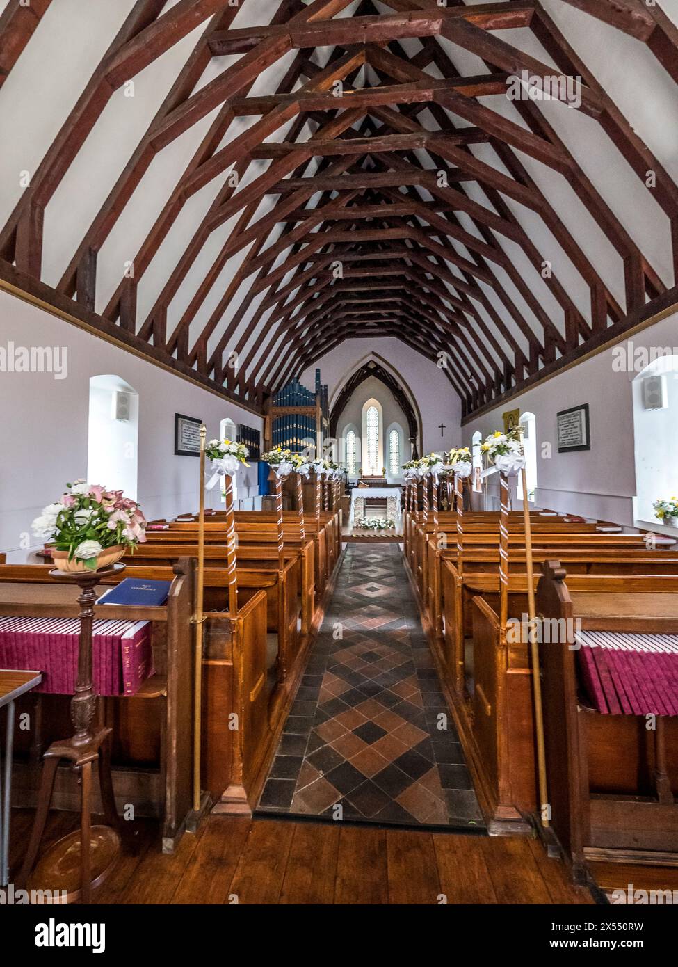 The image is of the interior of Christ Church in the town of Laxey on the Isle of Man. The roof made to resemble an upturned Viking Longship Stock Photo