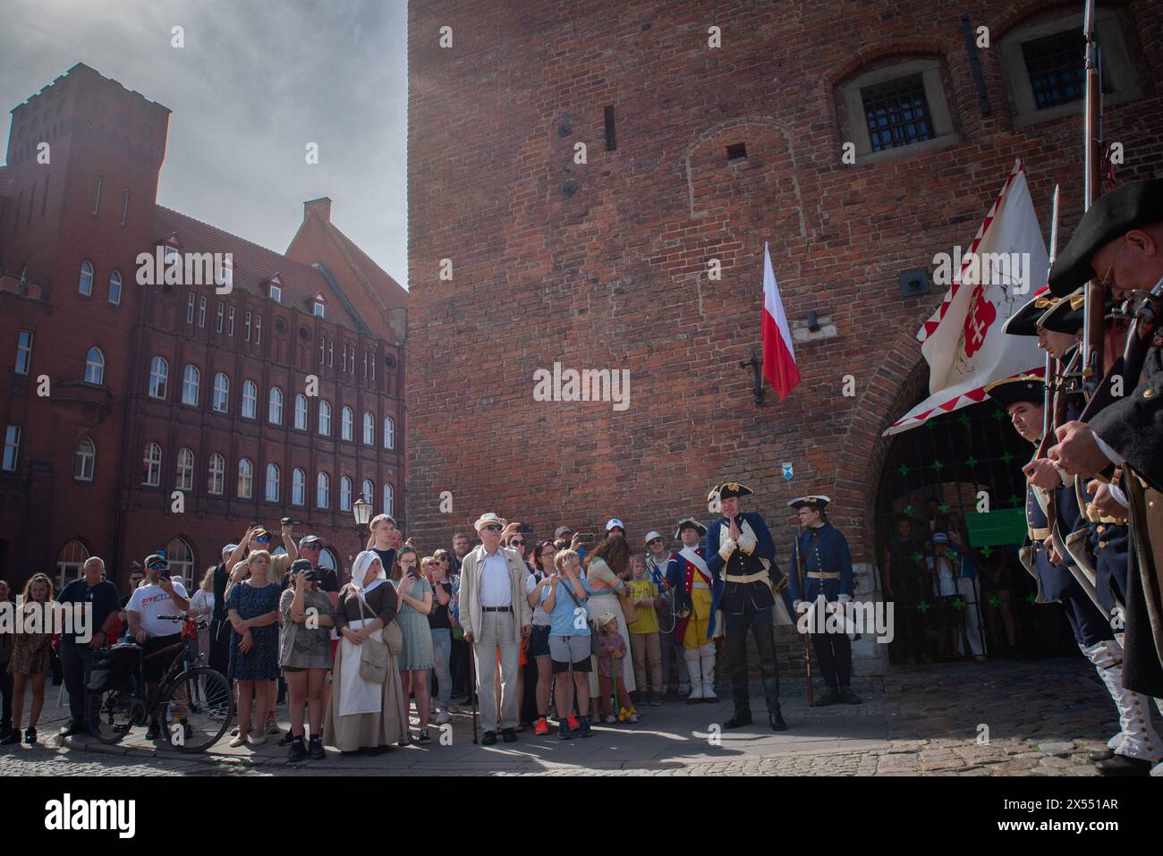 People watch the historic changing of the guard at the prison tower ...