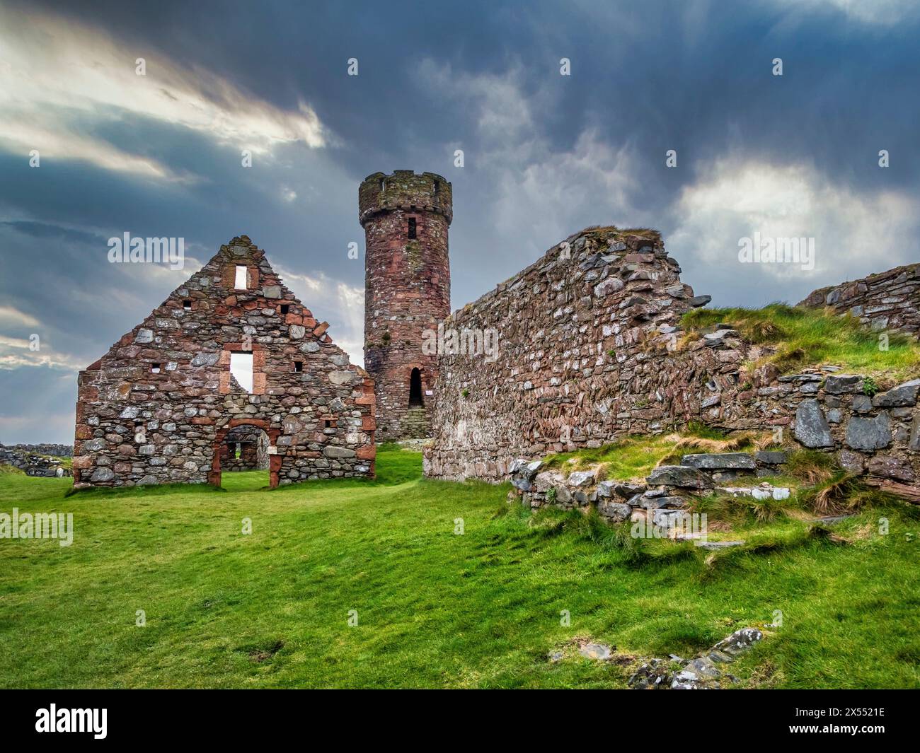 General scenic image at the historic 12th century Peel Castle and Abbey on the west coast of the Isle of Man, looking towards the defensive tower. Stock Photo