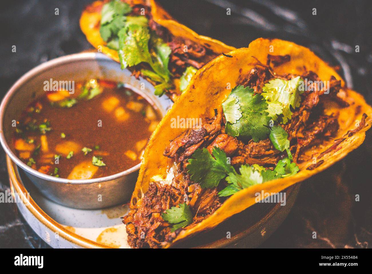 Beefy Birria Tacos made using 8 hour slow cooked chuck with beef