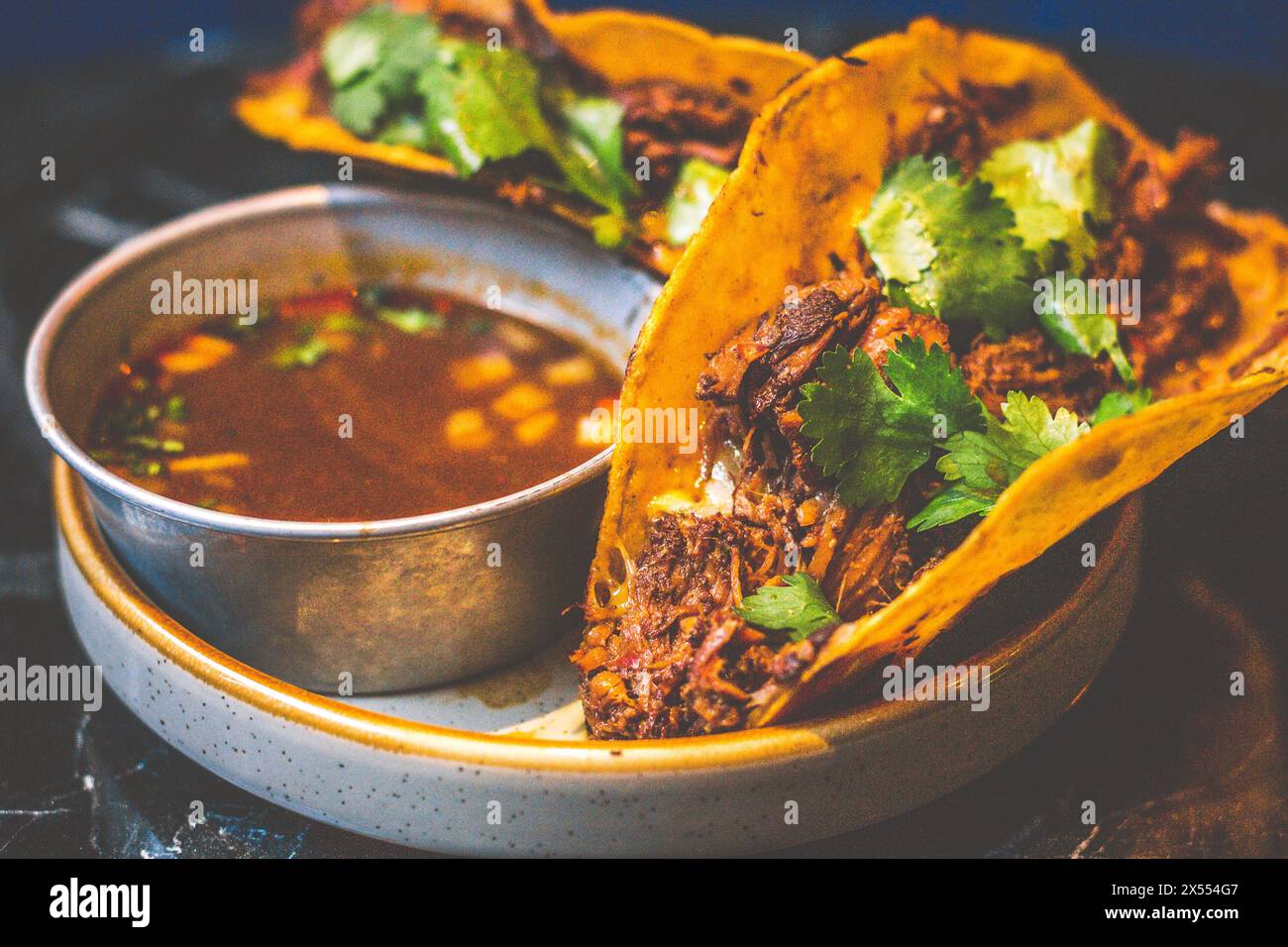 Beefy Birria Tacos made using 8 hour slow cooked chuck with beef