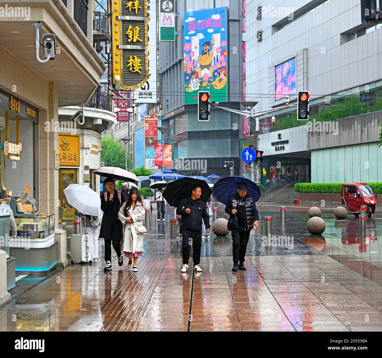 Shanghai, China - May 05, 2024; Rainy Day in Nanjing Road, a Pedestrian ...