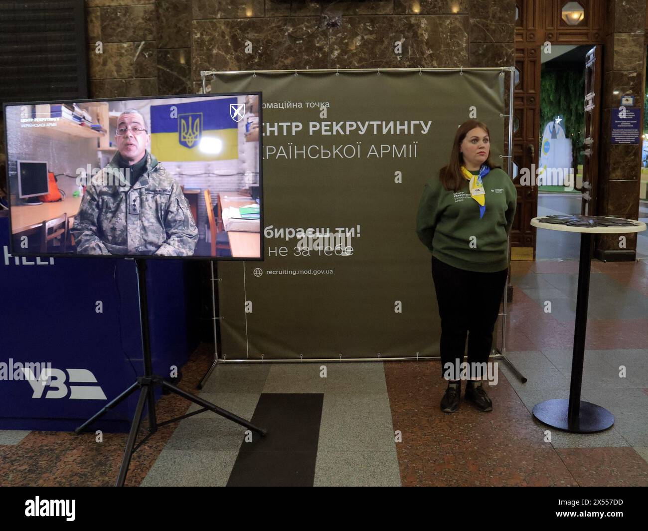 KYIV, UKRAINE - MAY 07, 2024 - A representative of the Ukrainian Armed Forces recruitment information center is seen at the Central Railway Station, Kyiv, capital of Ukraine. Stock Photo