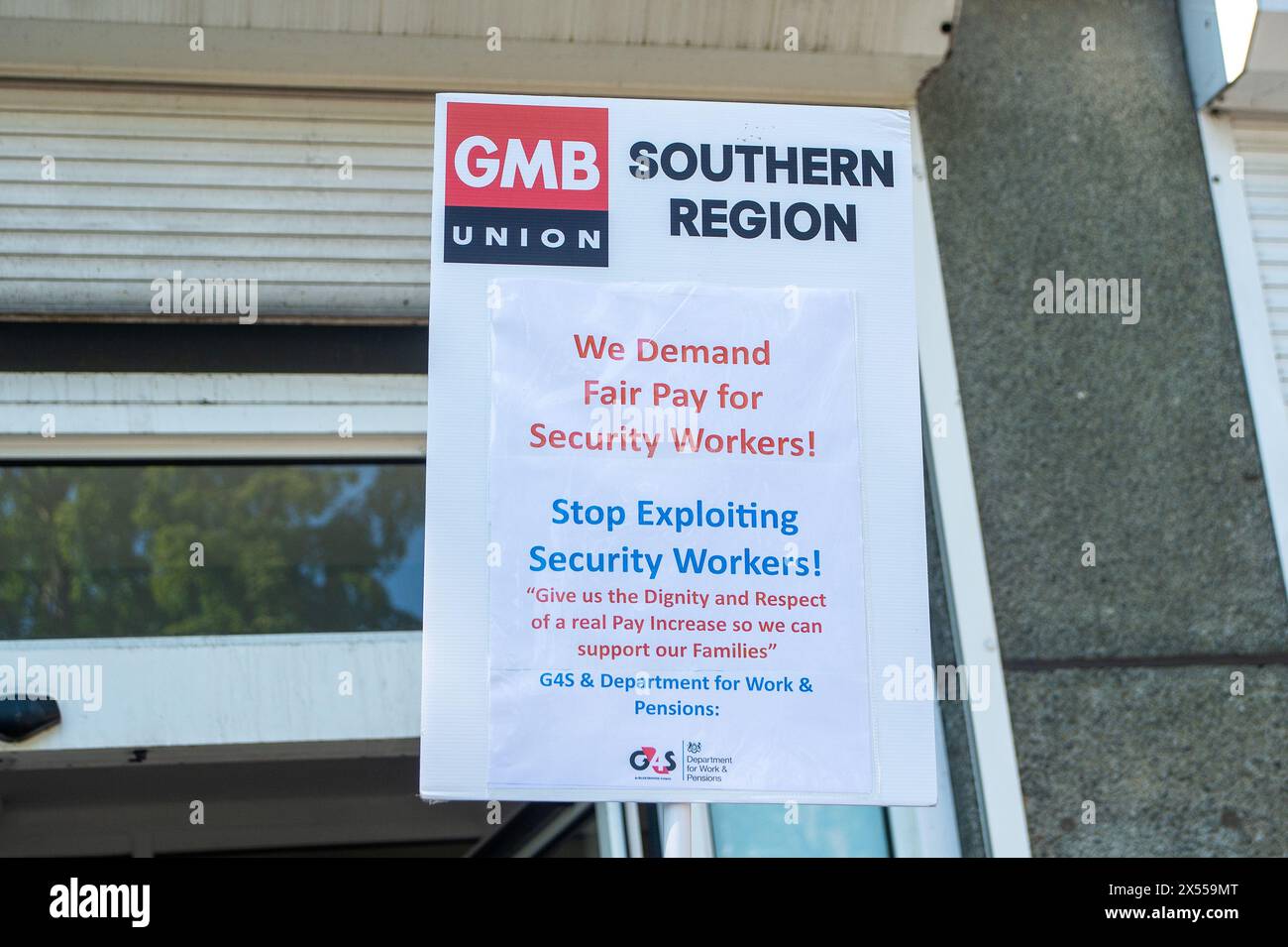 Slough, UK. 7th May, 2024. Security guards were on strike today outside the Job Centre Plus in Slough, Berkshire. They are holding a 24 hour strike in a dispute over their pay rates. GMB said more than 1,000 of its members employed by G4S will walk out today with further strike action planned for later this month. A survey of GMB members found four out of five had experienced abuse in their jobs, including being attacked by dogs and punched by members of the public. Many described daily verbal abuse, including threats to their families, racist abuse and death threats. Further strikes will take Stock Photo