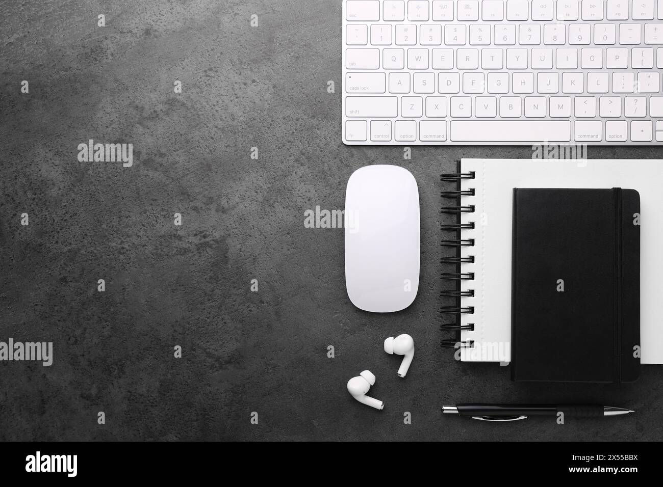Flat lay composition with different office stationery on dark grey ...