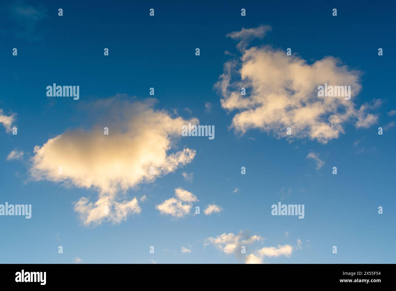 View of blue sky with white clouds. Beautiful day. Exuberant nature Stock Photo