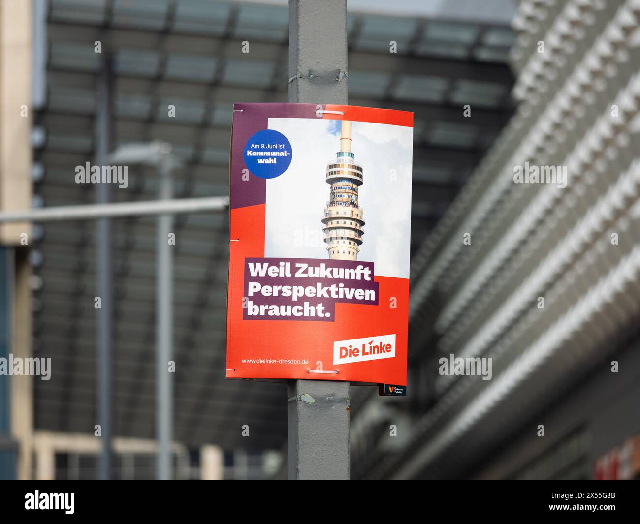 Die Linke (the left) election campaign poster for the communal elections in Saxony. The television tower building is on the advertisement placard. Stock Photo