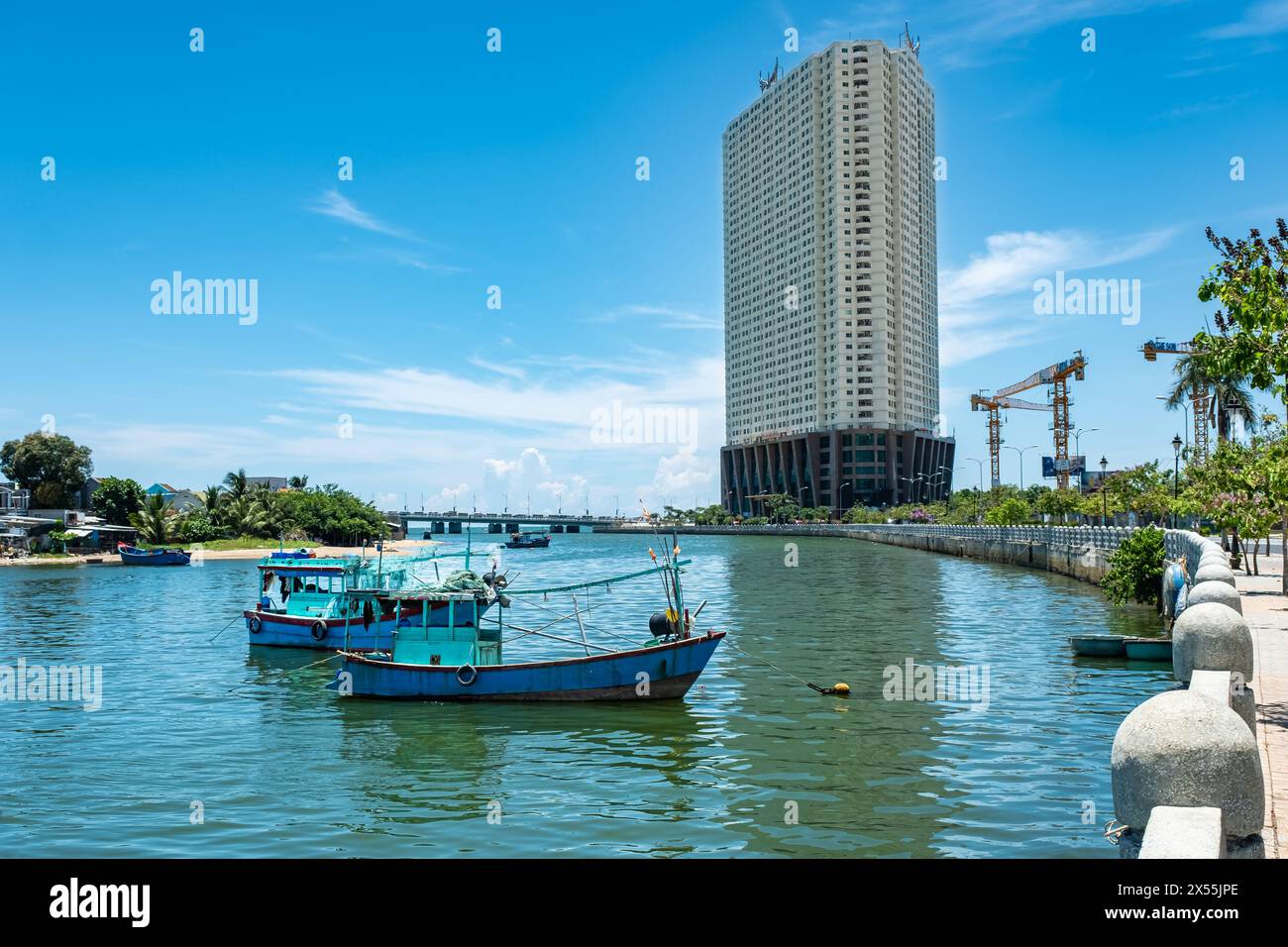 River Kai and the city. The coastal city of Nha Trang and bridge over the river on a sunny summer day. The Kai River in Nha Trang urban landscape, cit Stock Photo