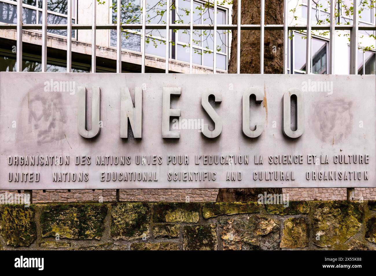 UNESCO (United Nations Educational Scientific and Cultural Organization) sign and headquarters building  in Paris, France Stock Photo