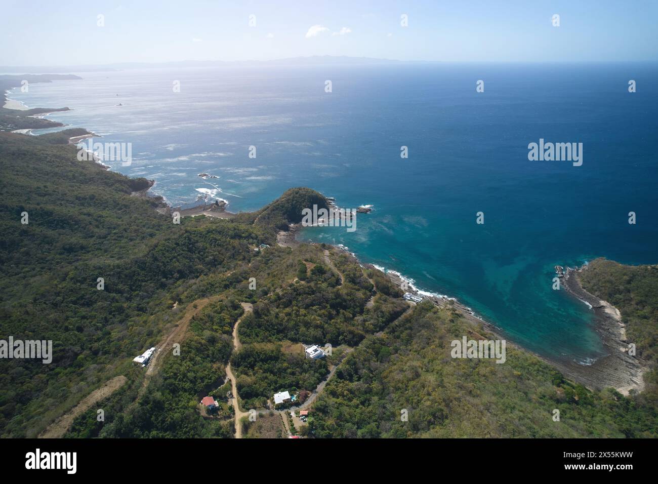 Ocean coastline aerial view on bright sunny day Stock Photo