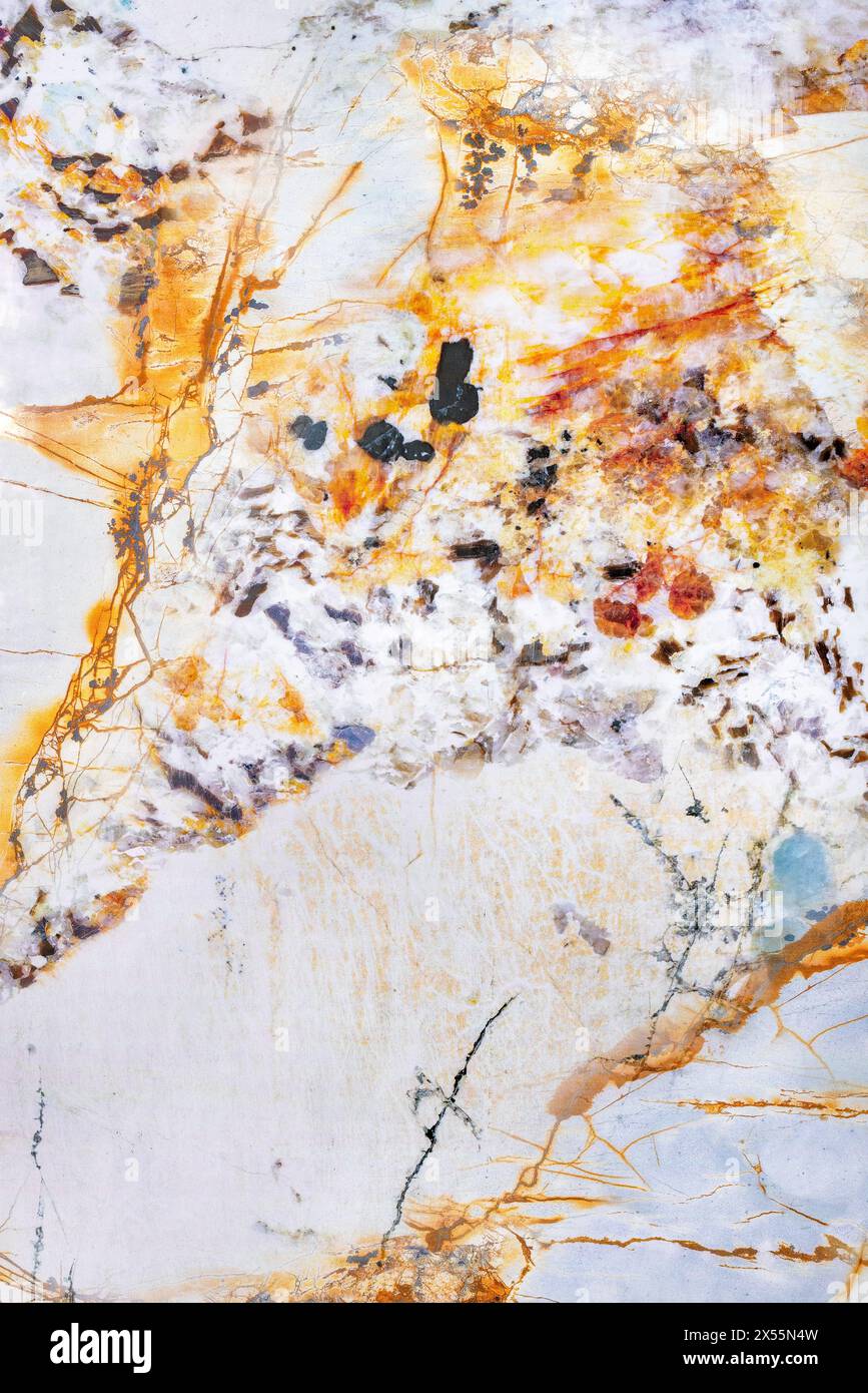 Beautiful texture of old marble with brown splashes of orange onyx, abstract pattern of old stone in section. Stock Photo