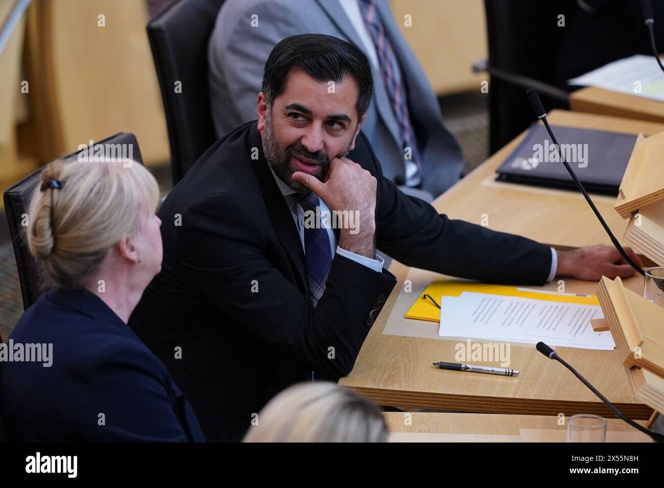 Humza Yousaf talks with Deputy First Minister of Scotland Shona Robison, prior to making his final speech to the Scottish Parliament as outgoing First Minister at the Scottish Parliament in Edinburgh. Picture date: Tuesday May 7, 2024. Stock Photo