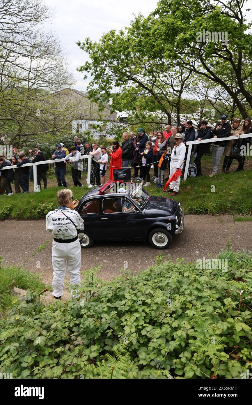 Fiat 500 driving up Test Hill at Italian Car Day at Brooklands, 4th May 2024, Brooklands Museum, Weybridge, Surrey, England, UK Stock Photo