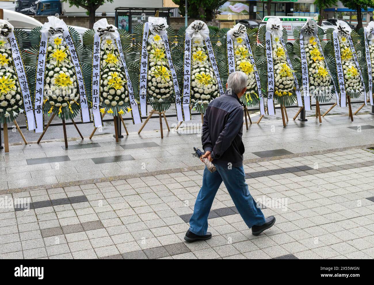 Seoul, South Korea. 07th May, 2024. Funeral wreaths set up by BTS fans protesting the Hybe are seen outside the headquarters of Hybe, the K-pop record label behind BTS and NewJeans. Hybe is in an internal conflict over management control with its affiliate agency, ADOR, which represents NewJeans. Credit: SOPA Images Limited/Alamy Live News Stock Photo