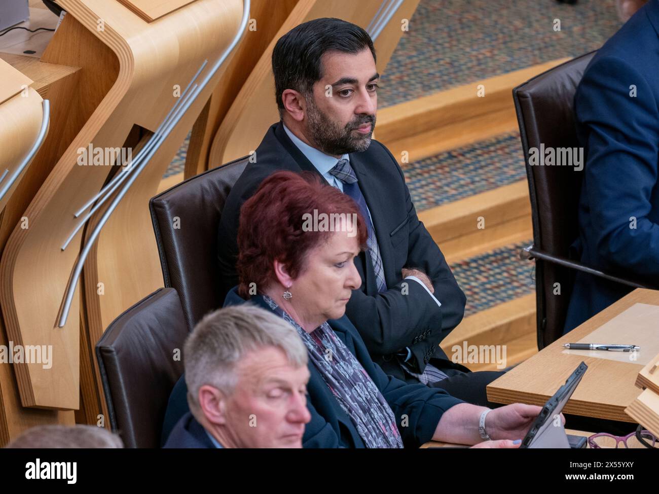 Former first minister Humza Yousaf on the back benches in the main chamber during the vote for the next First Minister at the Scottish Parliament in Edinburgh. Picture date: Tuesday May 7, 2024. Stock Photo