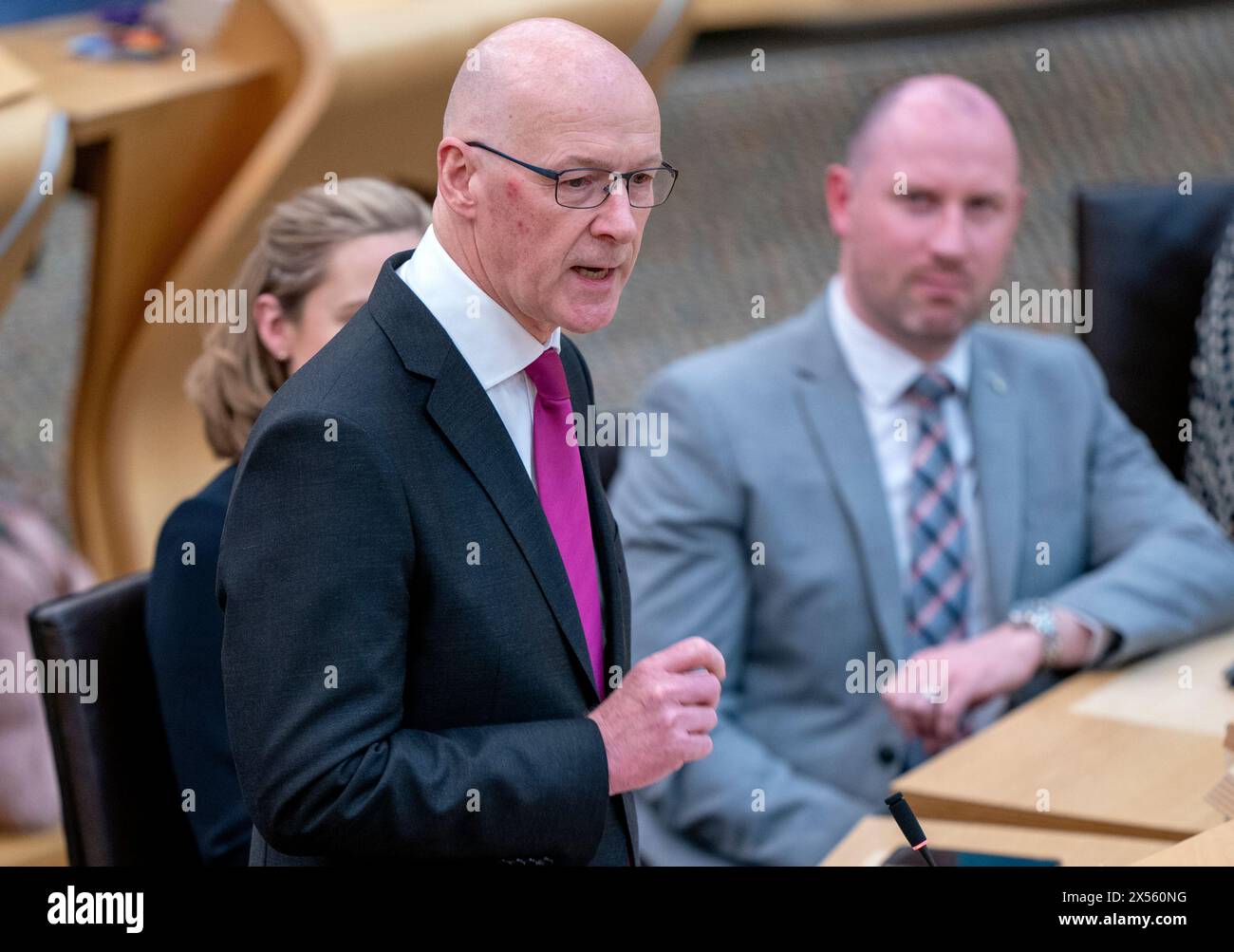 John Swinney speaks to the chamber after being voted in as First Minister at the Scottish Parliament in Edinburgh. Picture date: Tuesday May 7, 2024. Stock Photo