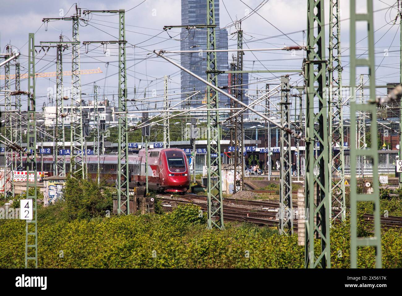 Eurostar high-speed train and tracks in the town district Deutz, in the background highrise building KoelnTurm at Mediapark, Cologne, Germany. Eurosta Stock Photo