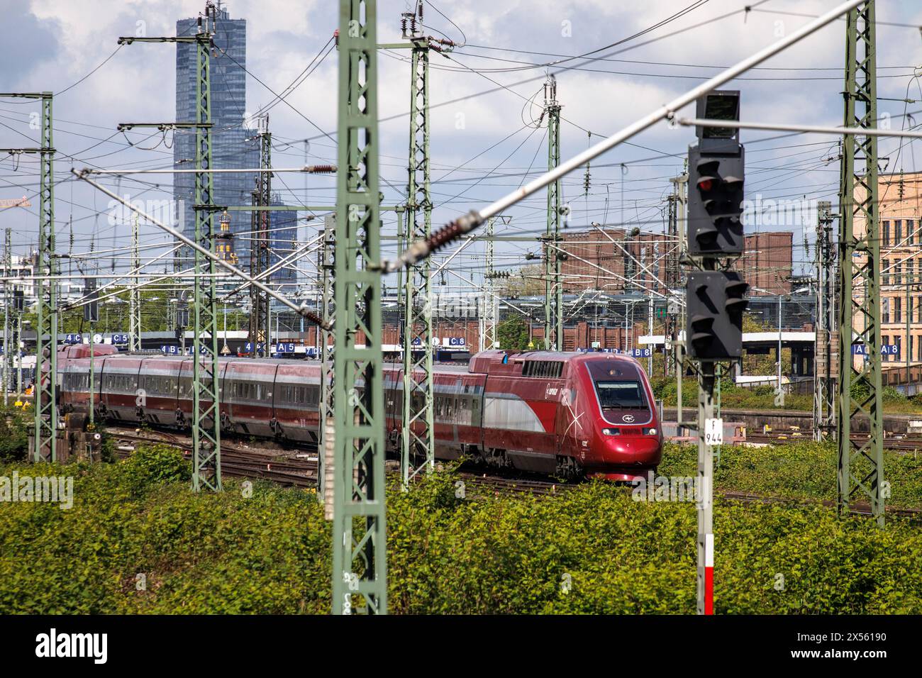 Eurostar high-speed train and tracks in the town district Deutz, in the background highrise building KoelnTurm at Mediapark, Cologne, Germany. Eurosta Stock Photo