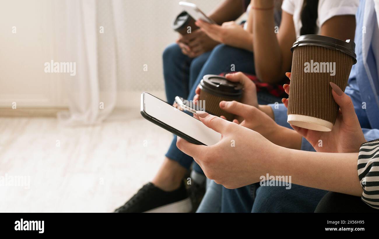 Human hands holding phones hi-res stock photography and images - Alamy