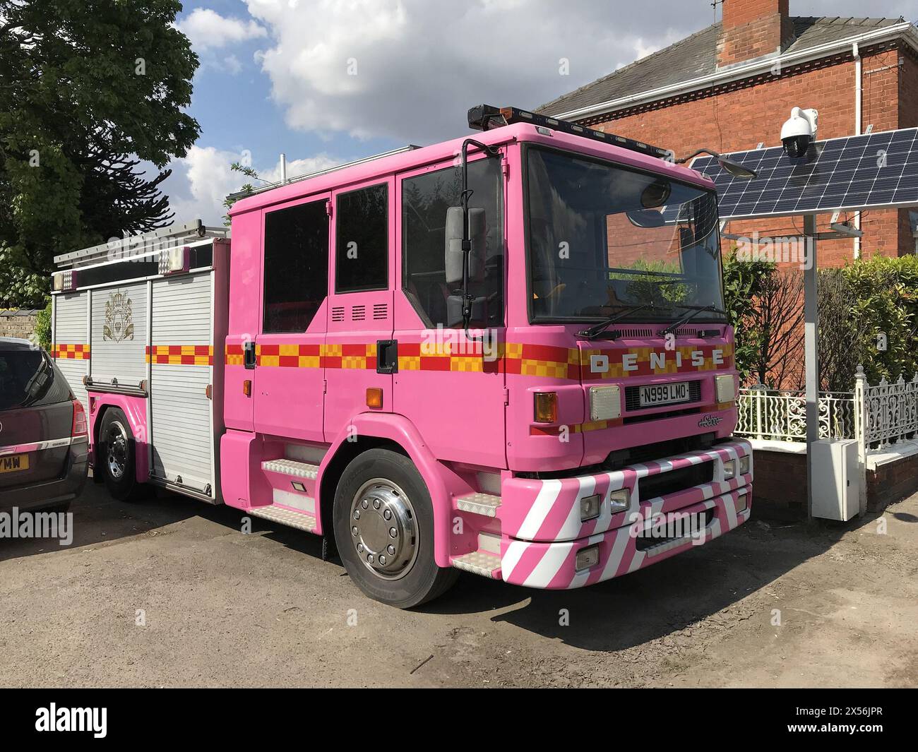 Pink Denis fire engine parked in the village Stock Photo