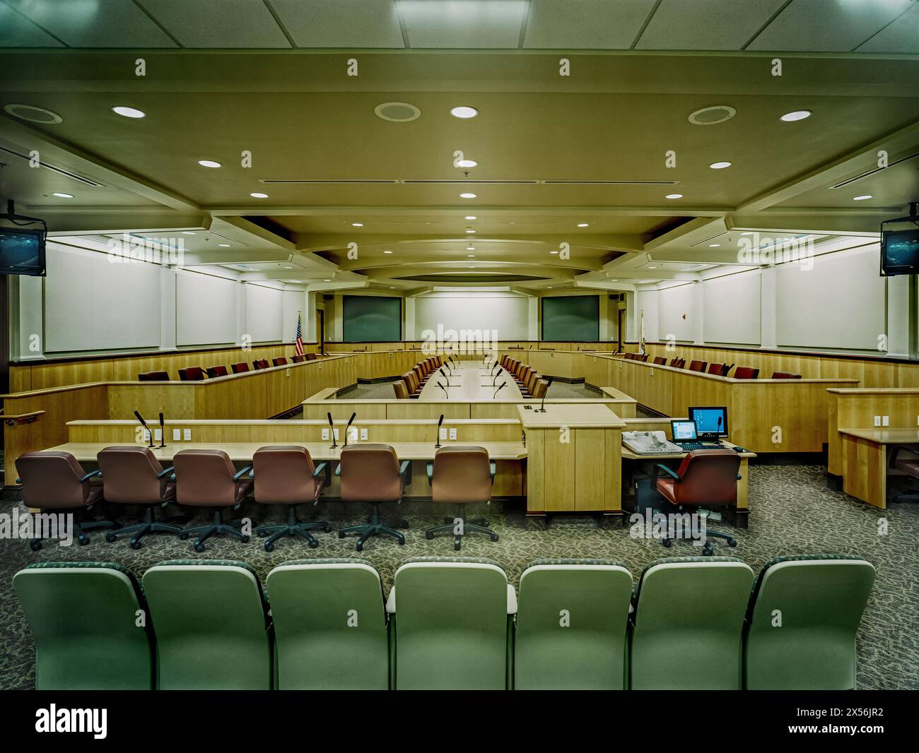 A large corporate conference room with built-in microphones for the ...