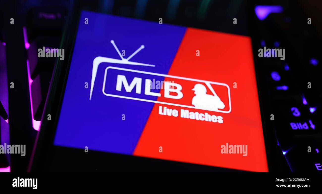 Viersen, Germany - May 1. 2024: Closeup of smartphone with logo lettering of MLB TV channel on computer keyboard Stock Photo