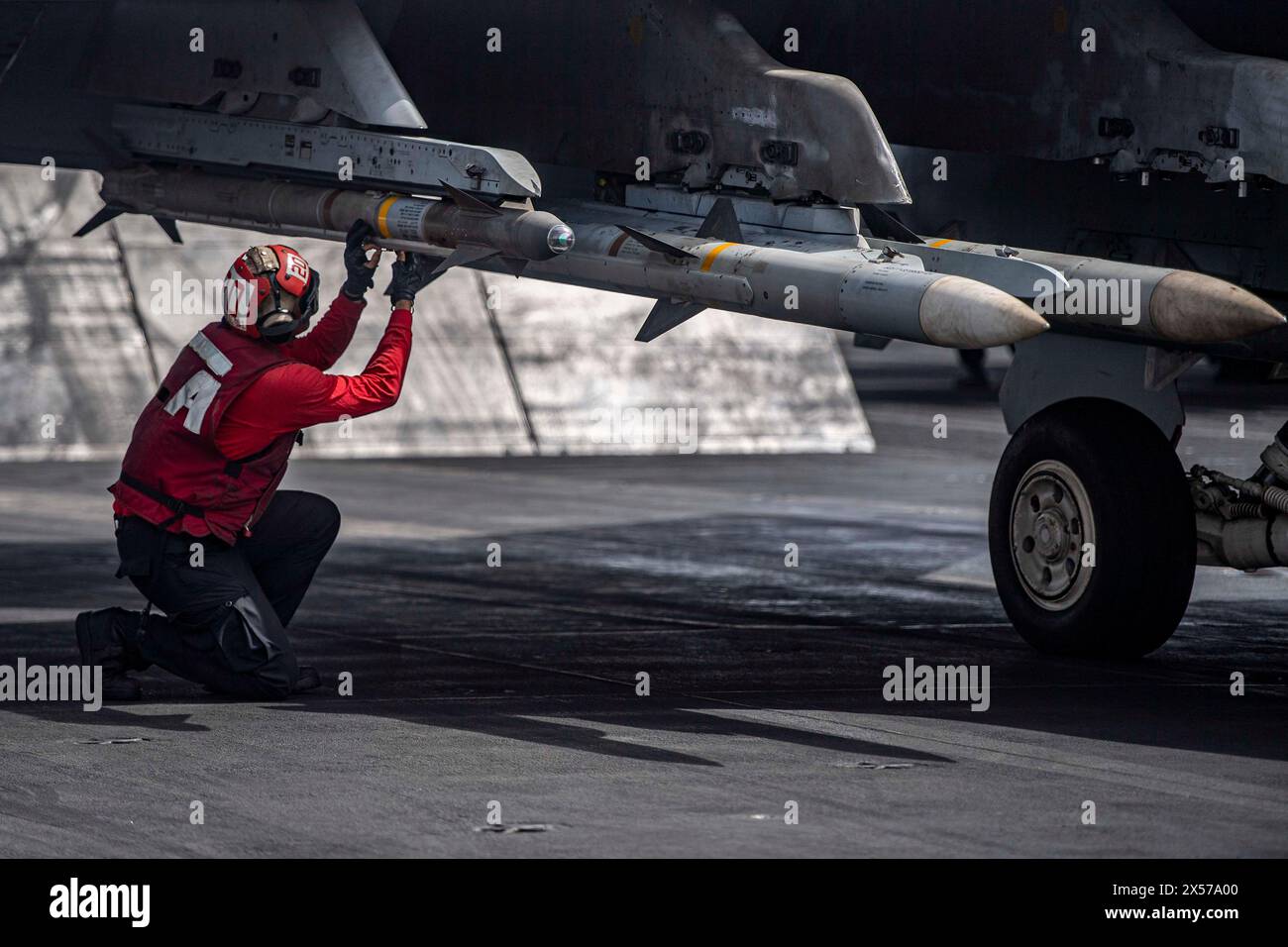 Red Sea, United States. 19 April, 2024. A U.S. Navy sailor Aviation Ordnancemen inspects ordnance attached to a F/A-18E Super Hornet fighter jet, with the Rampagers of Strike Fighter Squadron 83, before launch off the flight deck of the Nimitz-class aircraft carrier USS Dwight D. Eisenhower in support of Operation Prosperity Guardian, April 19, 2024 on the Red Sea. Credit: MC3 Janae Chambers/U.S. Navy Photo/Alamy Live News Stock Photo