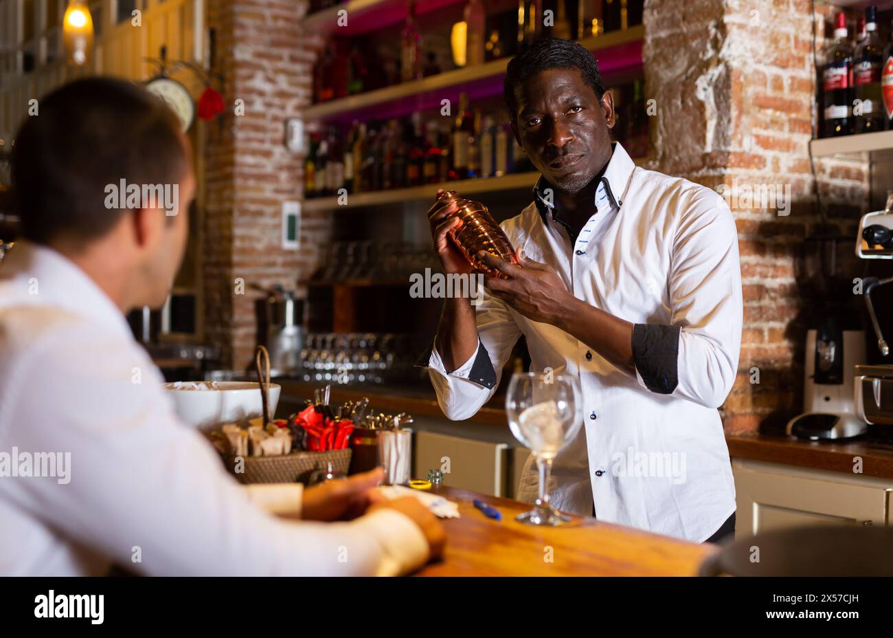 Bartender making cocktail Stock Photo