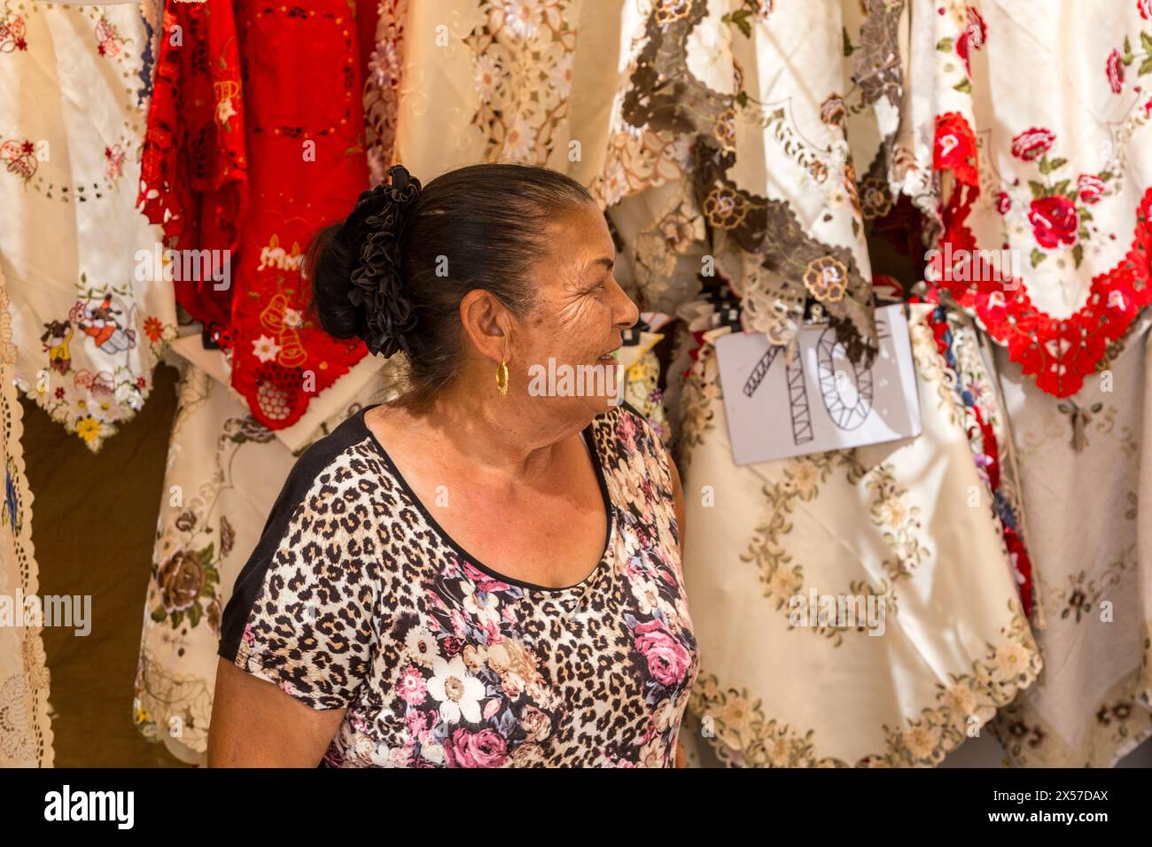 Woman selling embroidered lace at sunday market, Teguise, Lanzarote, Canary Islands, Spain Stock Photo