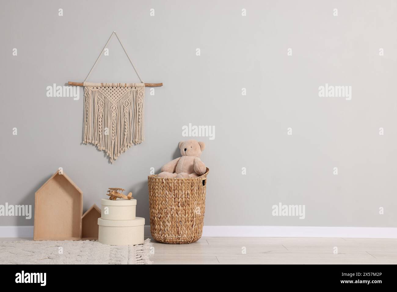 Beautiful children's room with grey wall, decor elements and toys ...