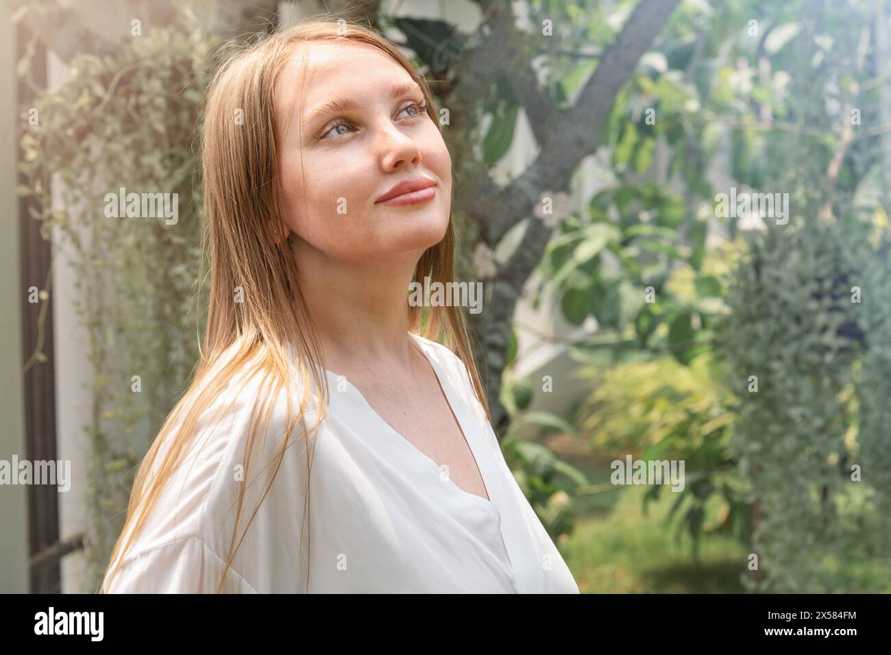 portrait of a cute young woman in the garden Stock Photo