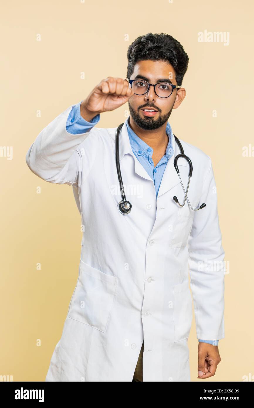 Knock-knock who is there. Excited Indian doctor cardiologist man ...