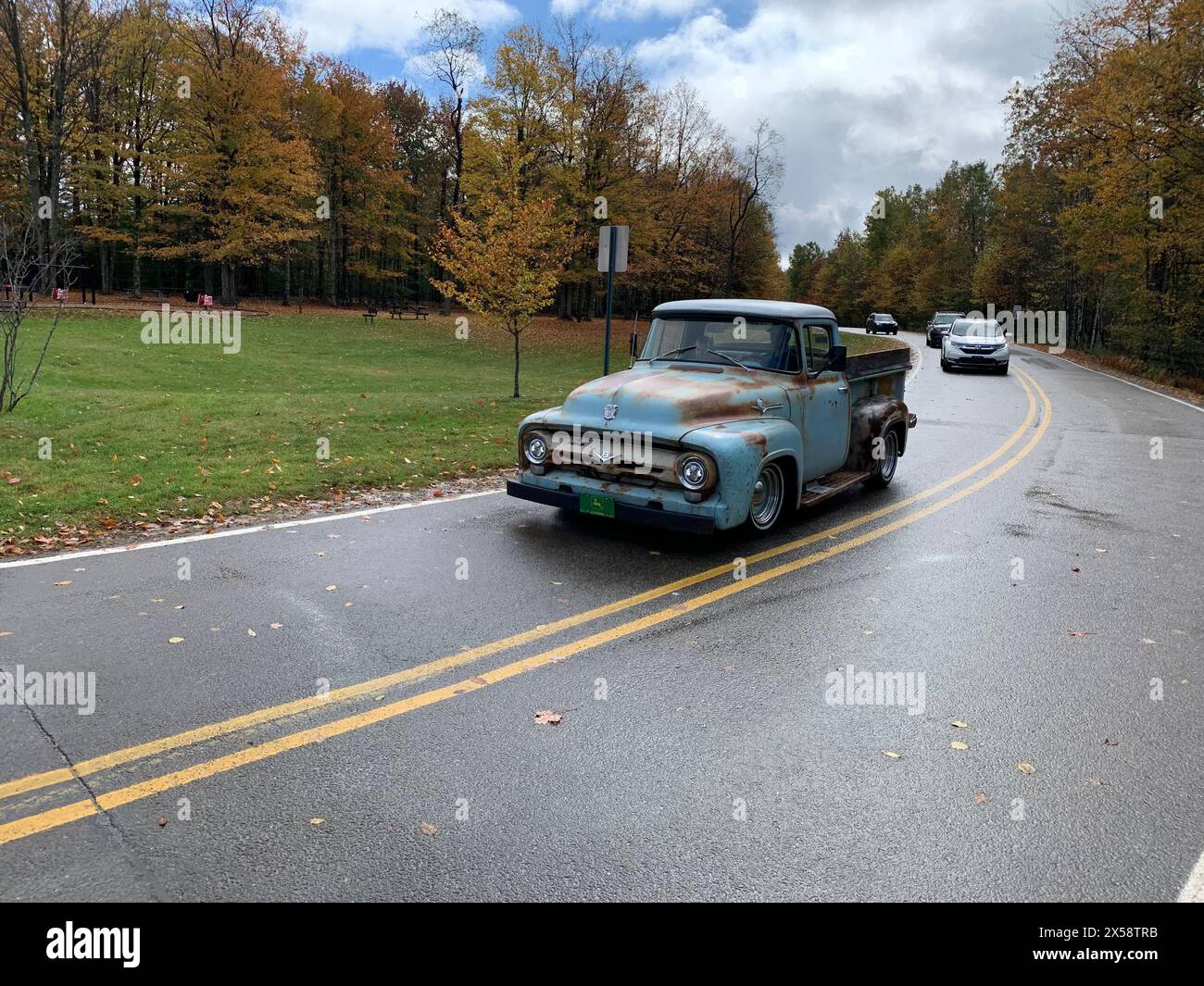 McKean County, Pennsylvania, USA, OCTOBER 8, 2023: Classic car driving. Blue Ford truck at driveway to Kinzua Bridge. Vintage, retro, nostalgia, old Stock Photo