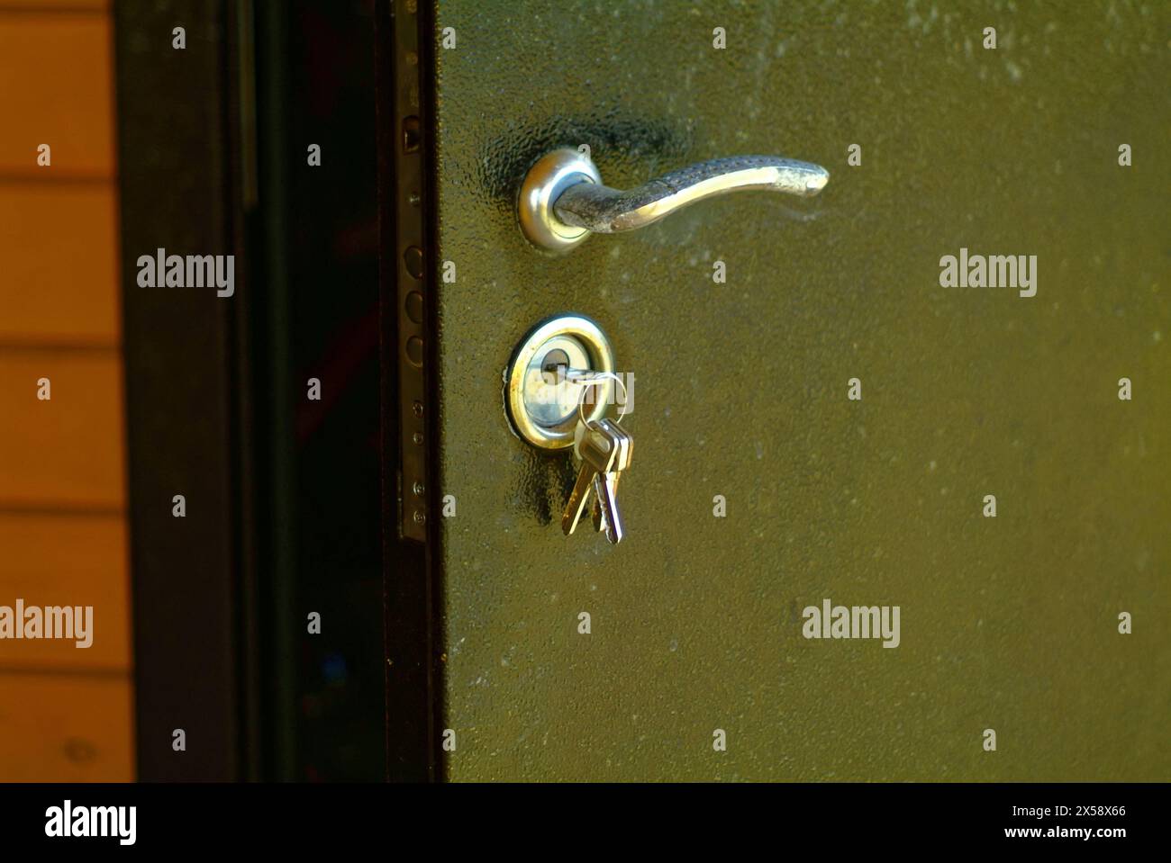 keys in metal door lock, in farmhouse Stock Photo