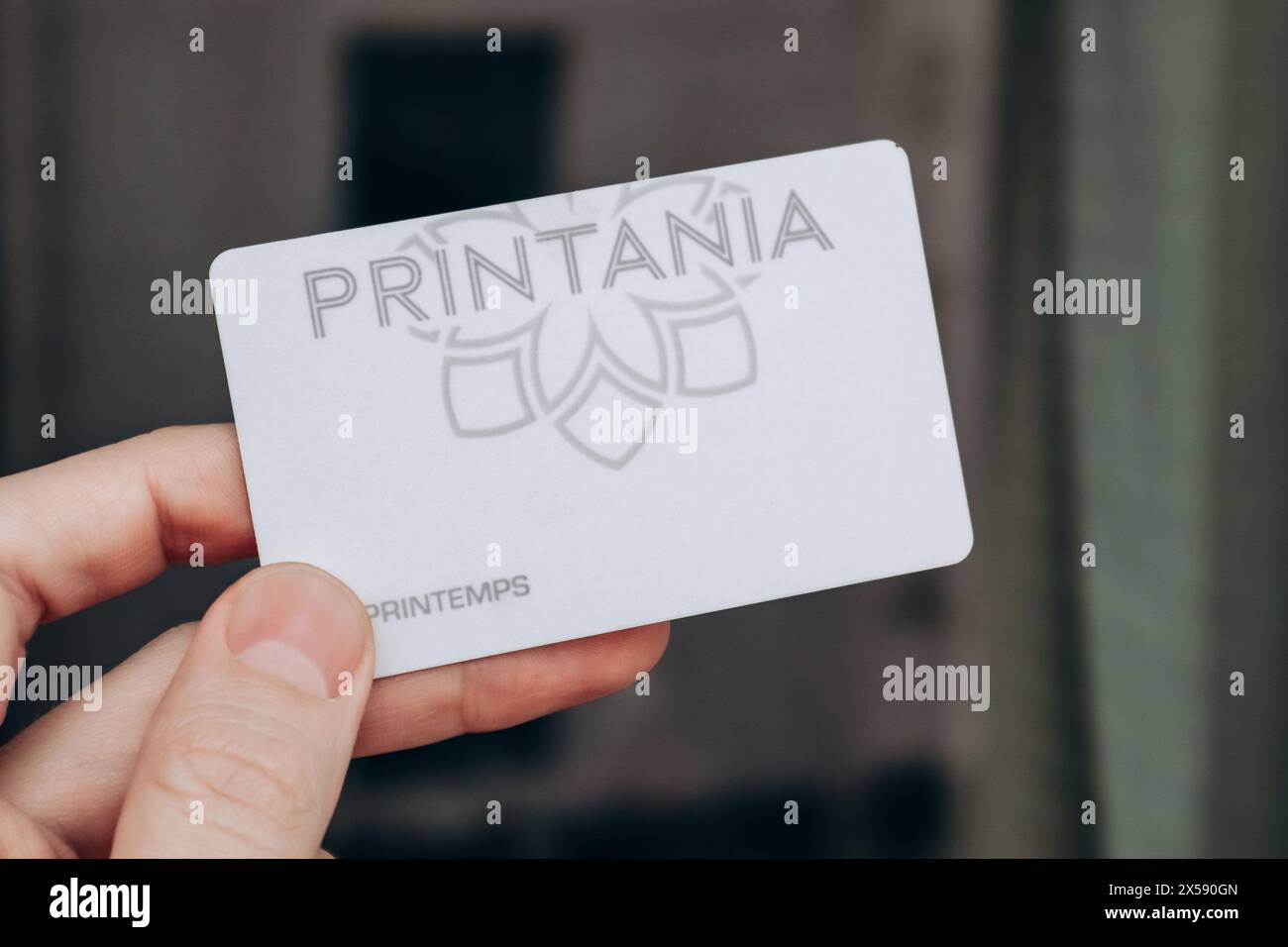 Nice, France - 27.01.2024: A man's hand holds a card of the Printemps department store Stock Photo