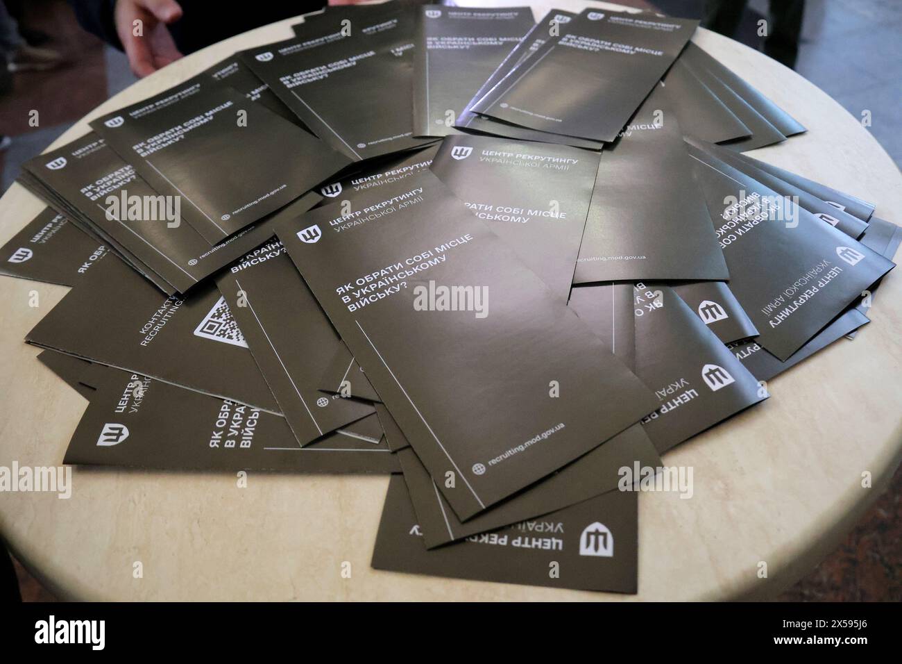 Non Exclusive: KYIV, UKRAINE - MAY 07, 2024 - Leaflets are seen on the premises of the Ukrainian Armed Forces recruitment information center at the Ce Stock Photo