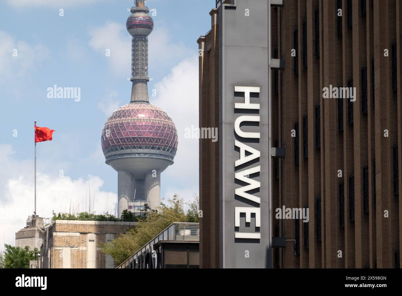 Shanghai, China. 08th May, 2024. The logo of Huawei's global flagship store is being displayed on the pedestrian street of Nanjing Road in the Huangpu district of Shanghai, China, on May 8, 2024. The Oriental Pearl Tower in Lujiazui is visible in the background to the left. (Photo by Costfoto/NurPhoto) Credit: NurPhoto SRL/Alamy Live News Stock Photo
