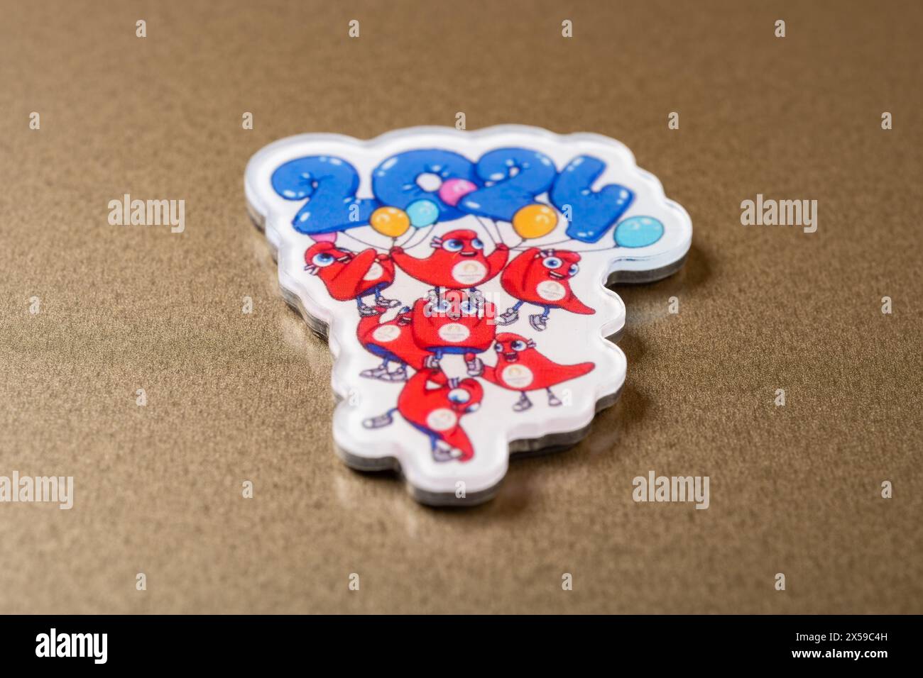 ZHONGSHAN China-April 28 2024: angle view refrigerator magnet with 2024 Paris Olympic Games mascot the Phryges. Stock Photo