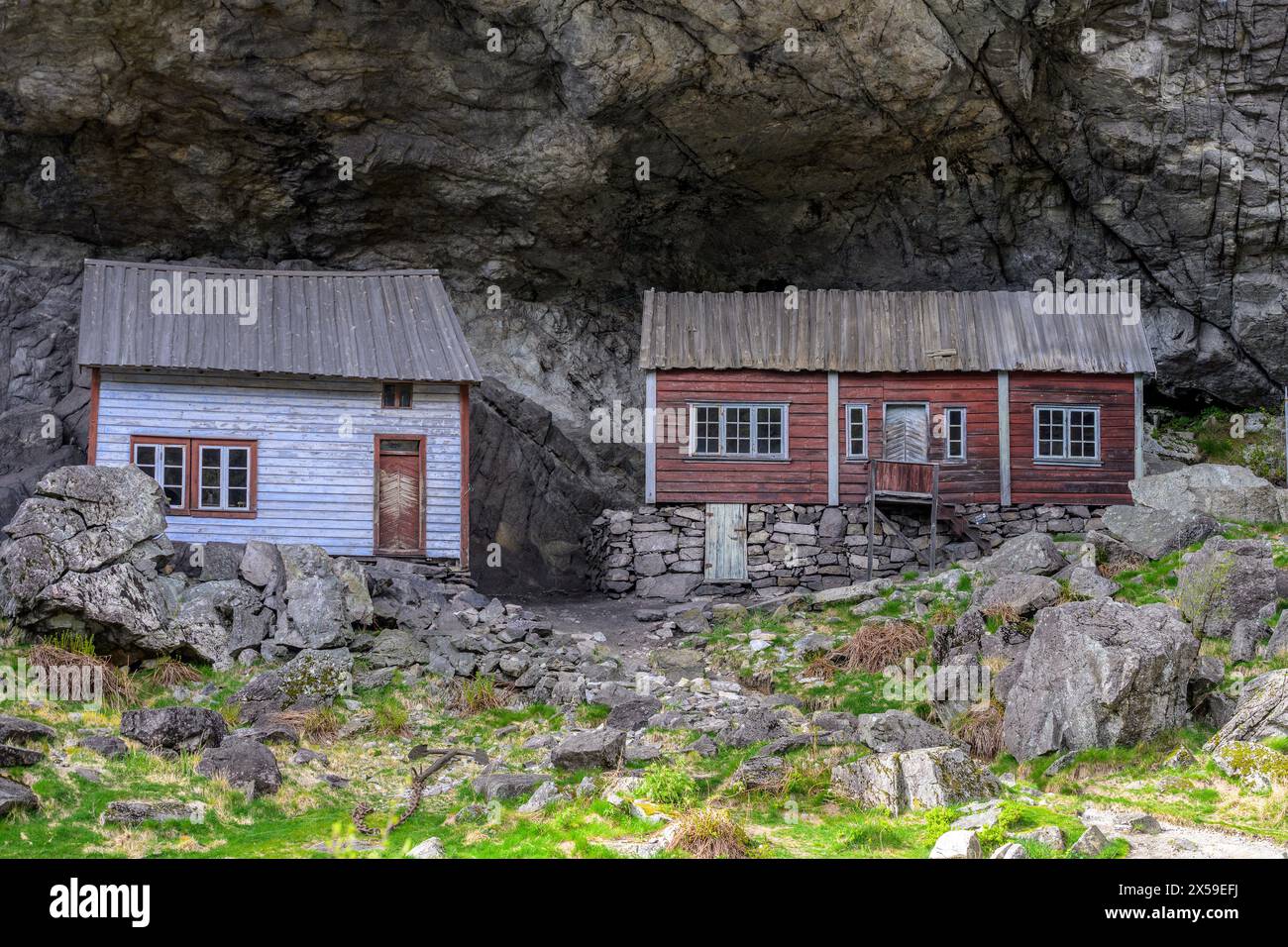 Houses built under a natural rock shelter. Known as 'Helleren' in Jössingfjord (Rogaland) dating back to the 1800s and is a famous historic site in No Stock Photo