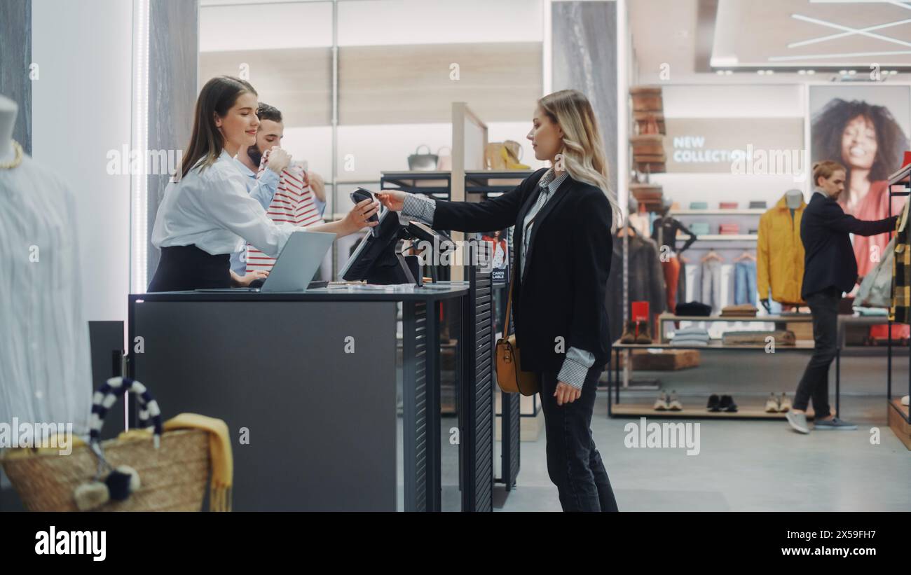 Clothes shop assistant counter hi-res stock photography and images - Alamy