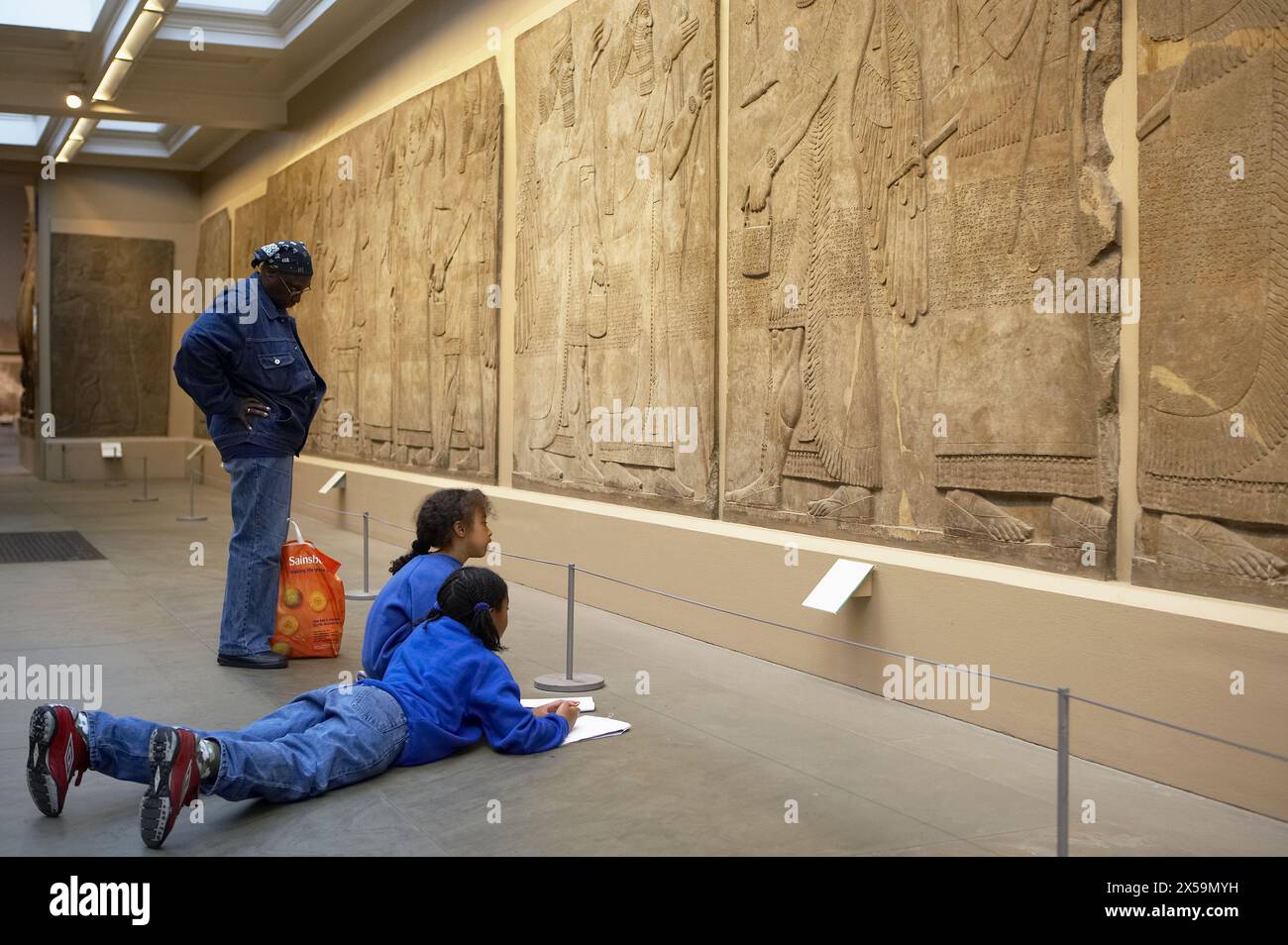 Stone panel from the Palace of Ashurnasirpal II, Nimrud Palace Reliefs, The British Museum, London. England. UK. Stock Photo
