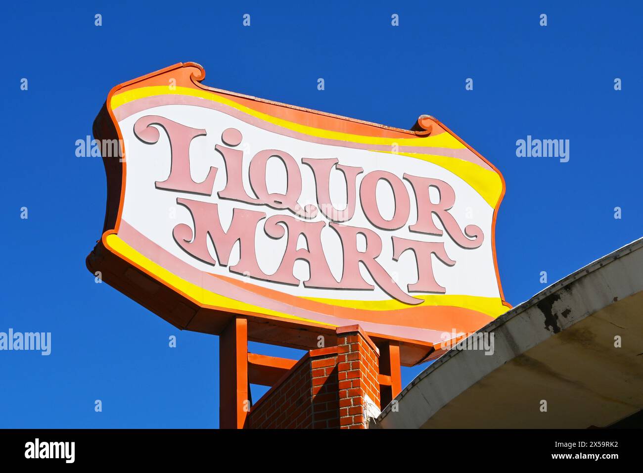 WHITTIER, CALIFORNIA - 28 APR 2024: Closeup of the Liquor Mart sign on Whittier Boulevard. Stock Photo