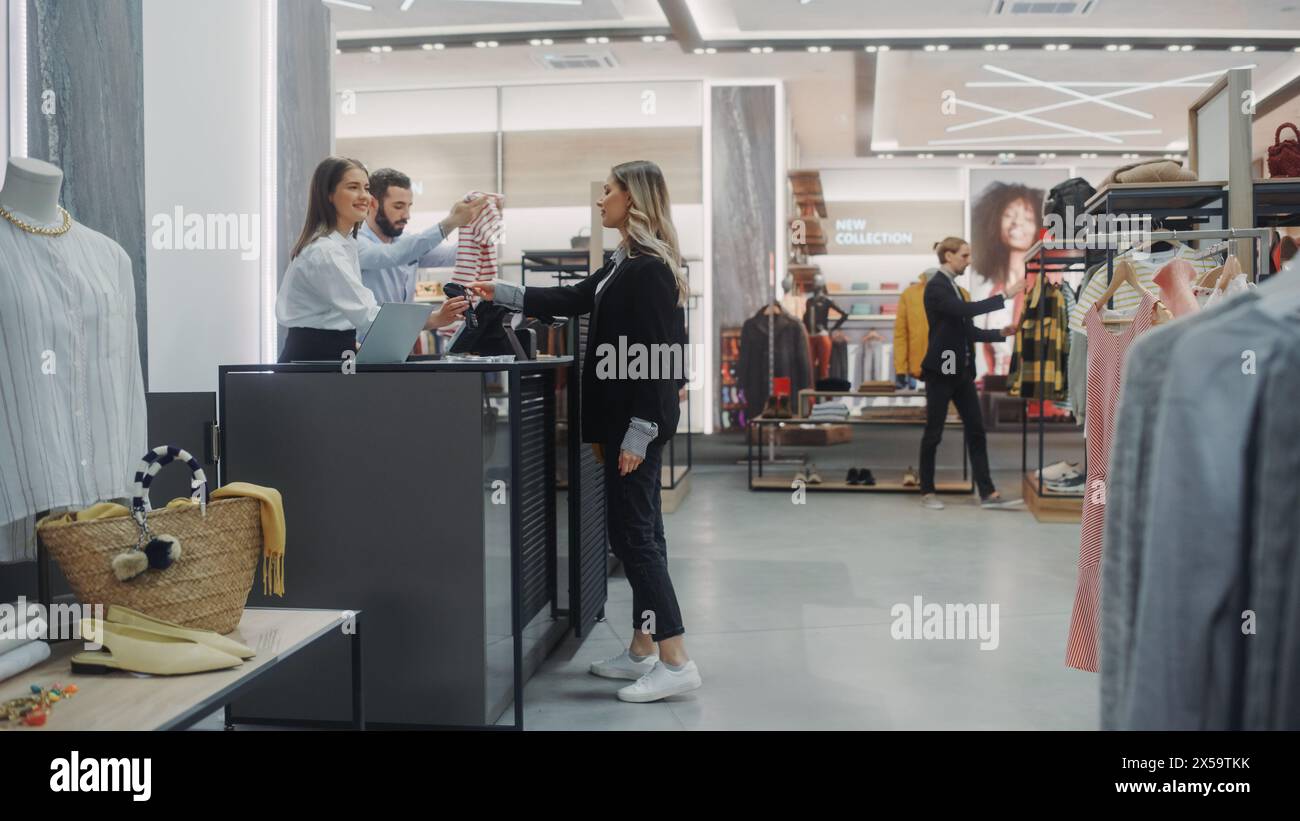 Clothes shop assistant counter hi-res stock photography and images - Alamy