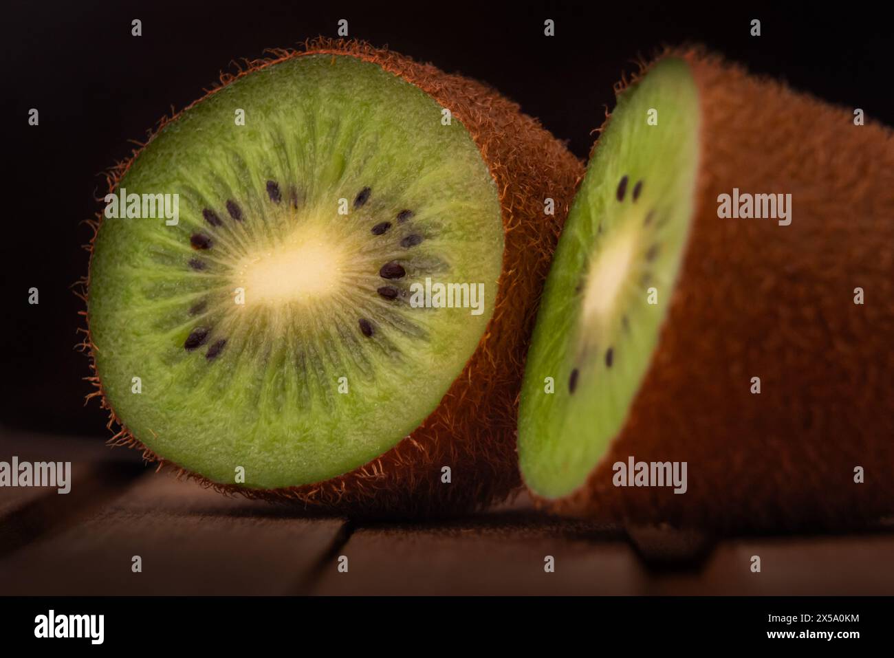 Kiwi Fruit or Chinese Gooseberry cut in half Stock Photo