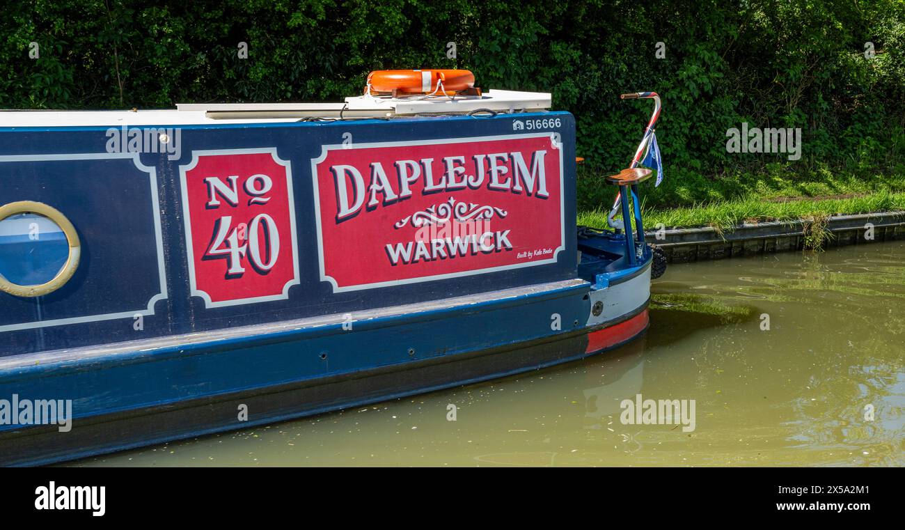 Oxford Canal, Near Rugby, England, UK – A narrowboat on a canal named Daplejem moored against the towpath Stock Photo
