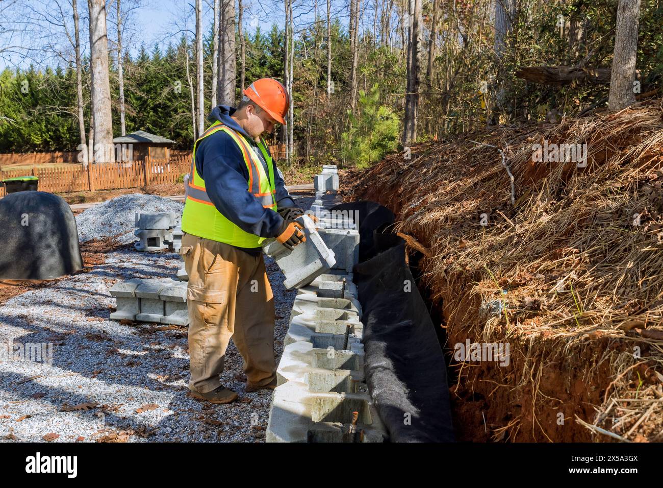 During installation of concrete block retaining wall, contractor ...