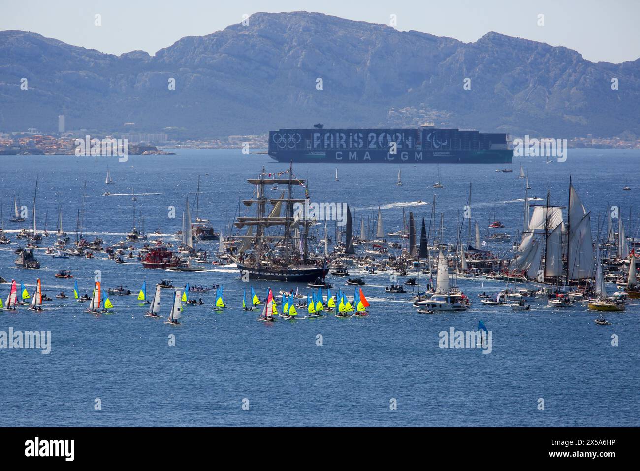 The French three-masted ship “Belem” arrives in Marseille. Coming from Athens with the Olympic flame on board, the Belem arrives in the harbor of Marseille and parades along the coast of the city of Marseille surrounded by thousand of boats. Stock Photo